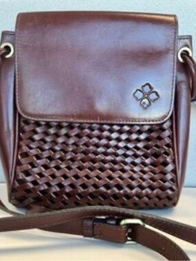 Patricia Nash Marisa flap crossbody bag featuring a hand-woven leather oxblood